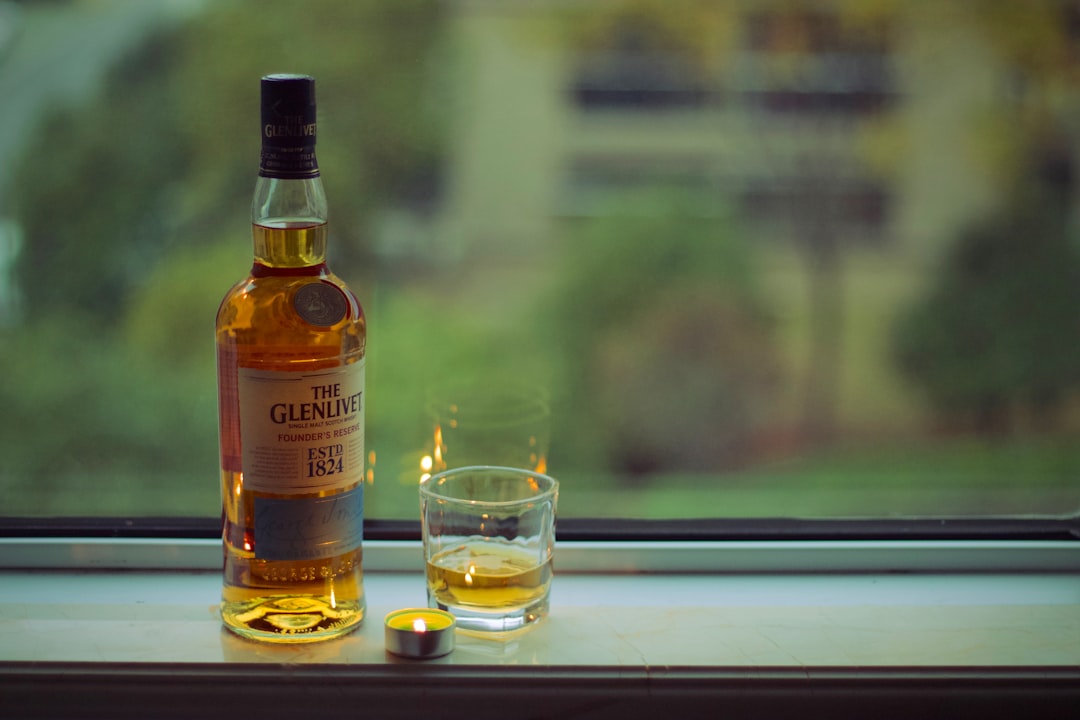 The Glenlivet whisky bottle near glass