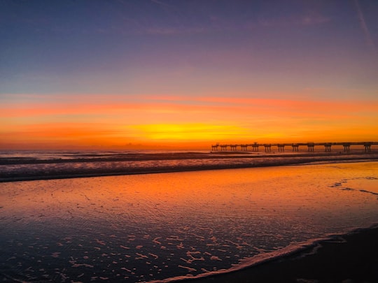 silhouette of dock during golden hour in Jacksonville Beach United States