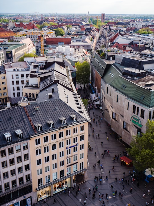 aerial photography of people walking along city street in Marienplatz Germany