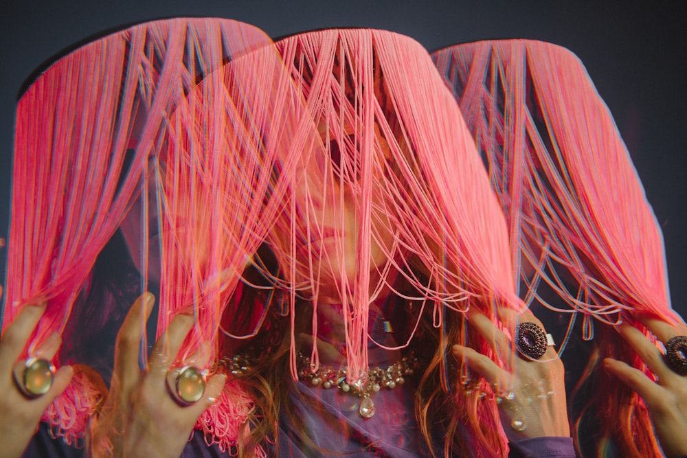 woman wearing pink hats