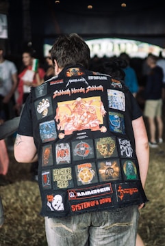 man wearing vest with garment patches on it