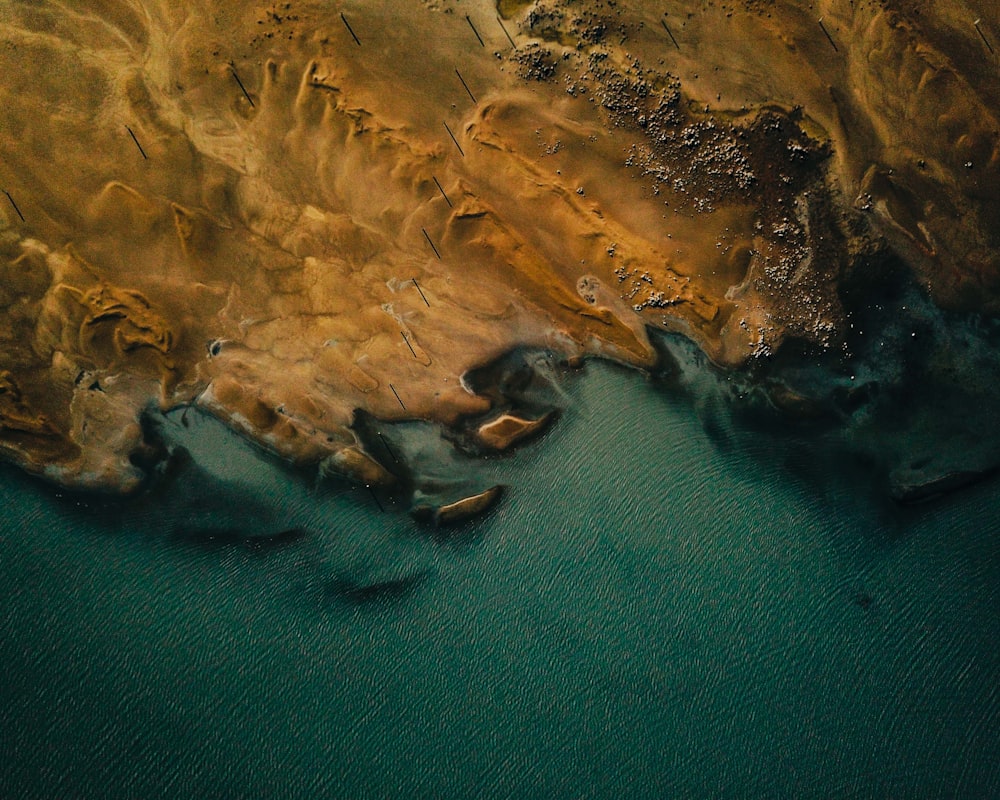 aerial photography of body of water and desert view