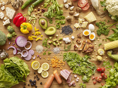 Close-up of diverse global food items arranged neatly.