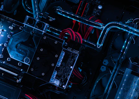 Close-up of advanced quantum computing hardware with glowing circuits and cables.