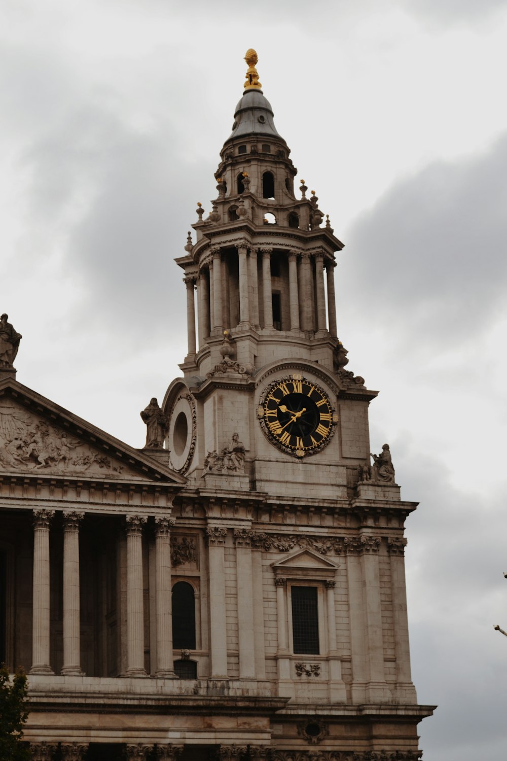 a very tall building with a clock on it's side