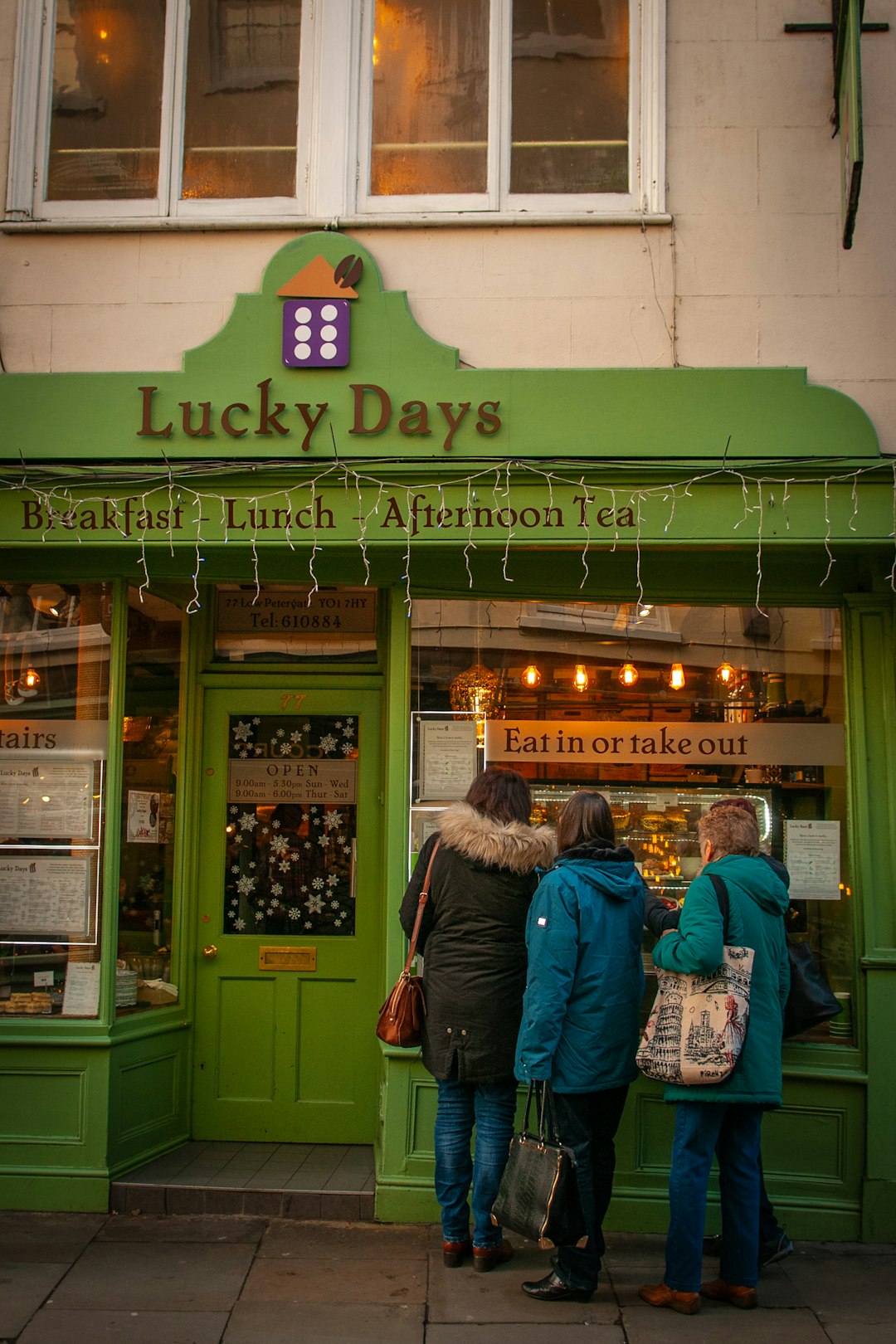 person in front of Lucky Days storefront