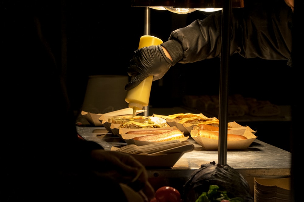 person making sandwiches