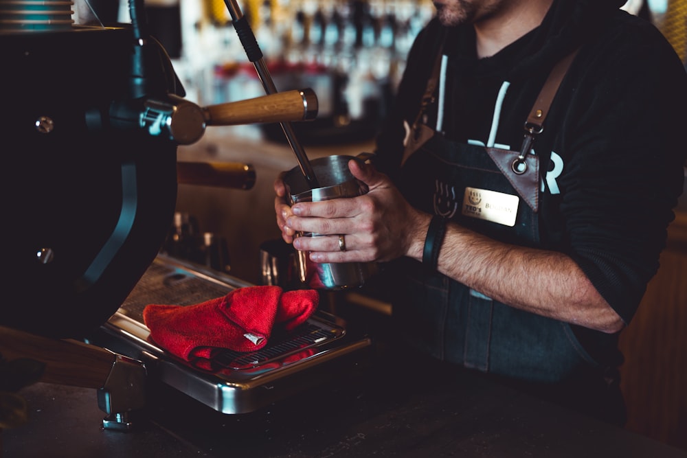 man making beverage