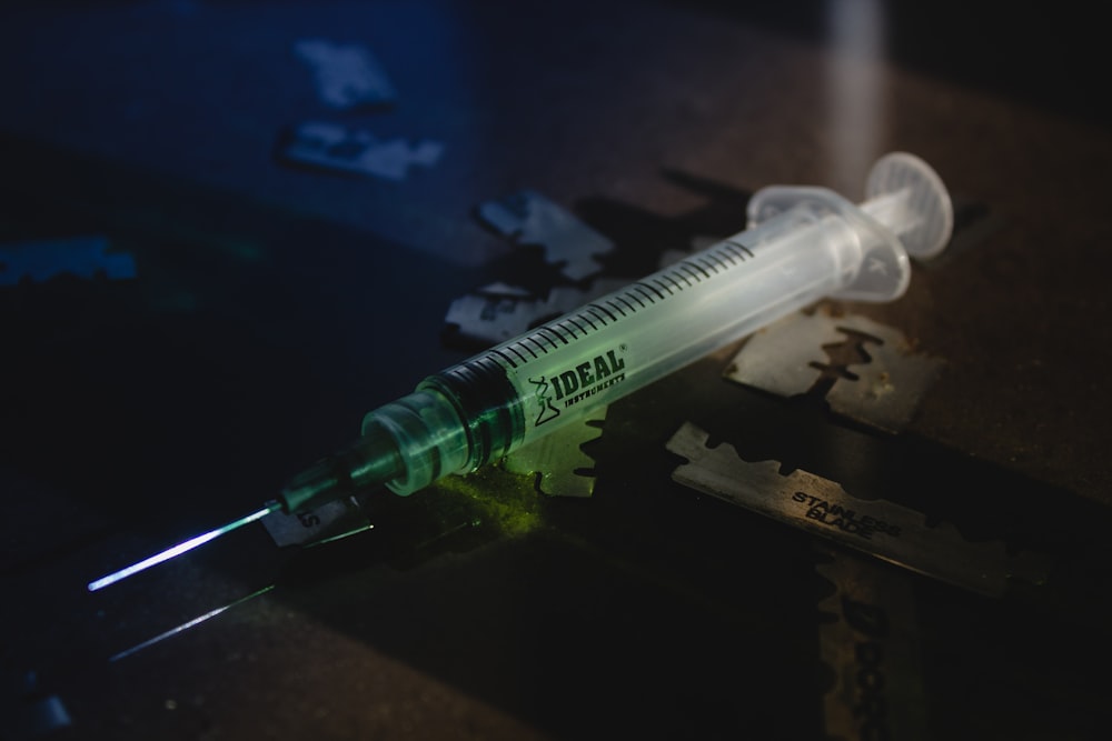 close up photography of white Ideal syringe