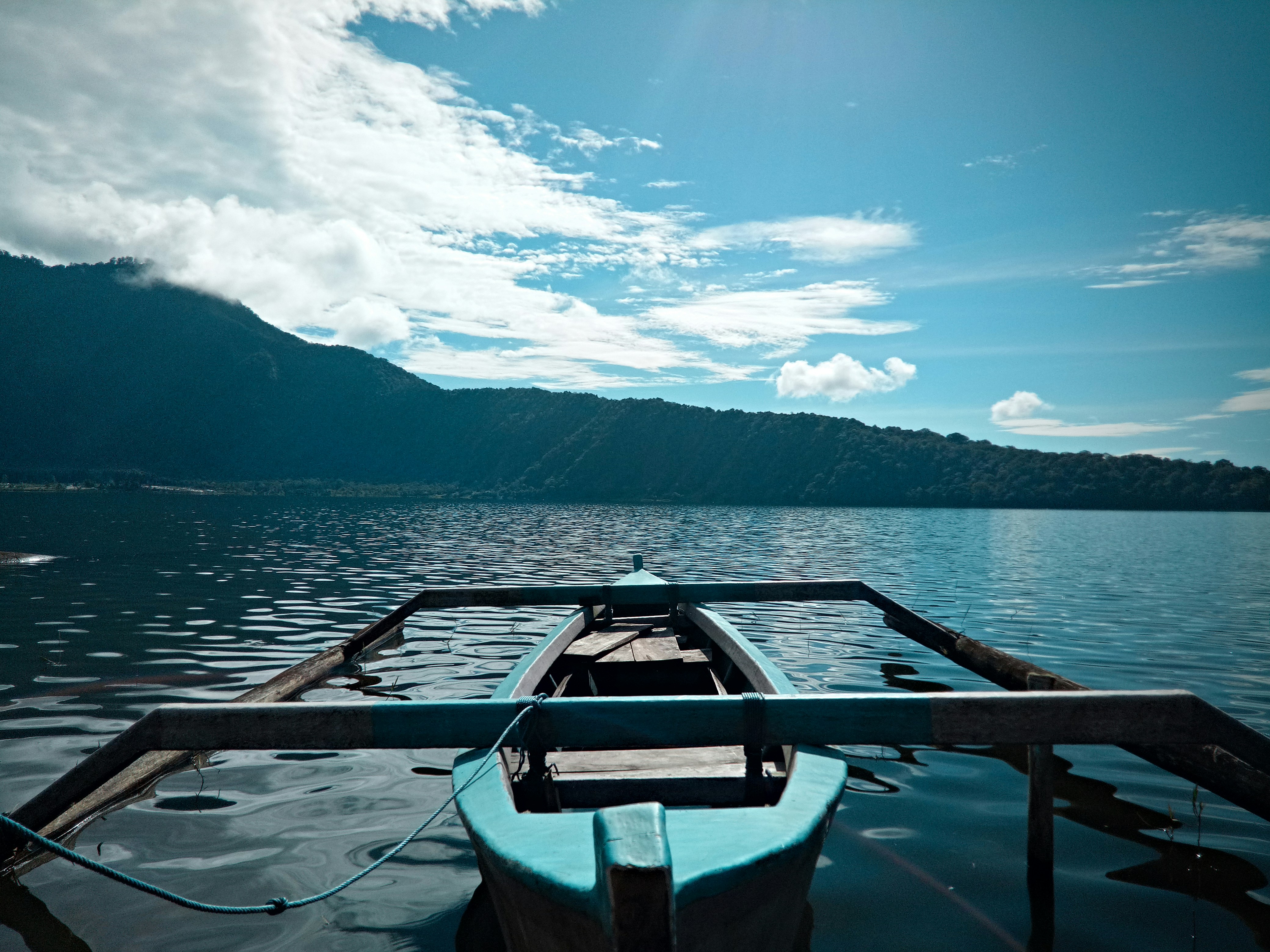 gray boat on body of water during daytime