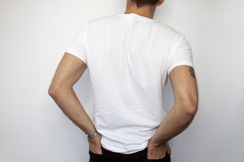 man holding his back pocket