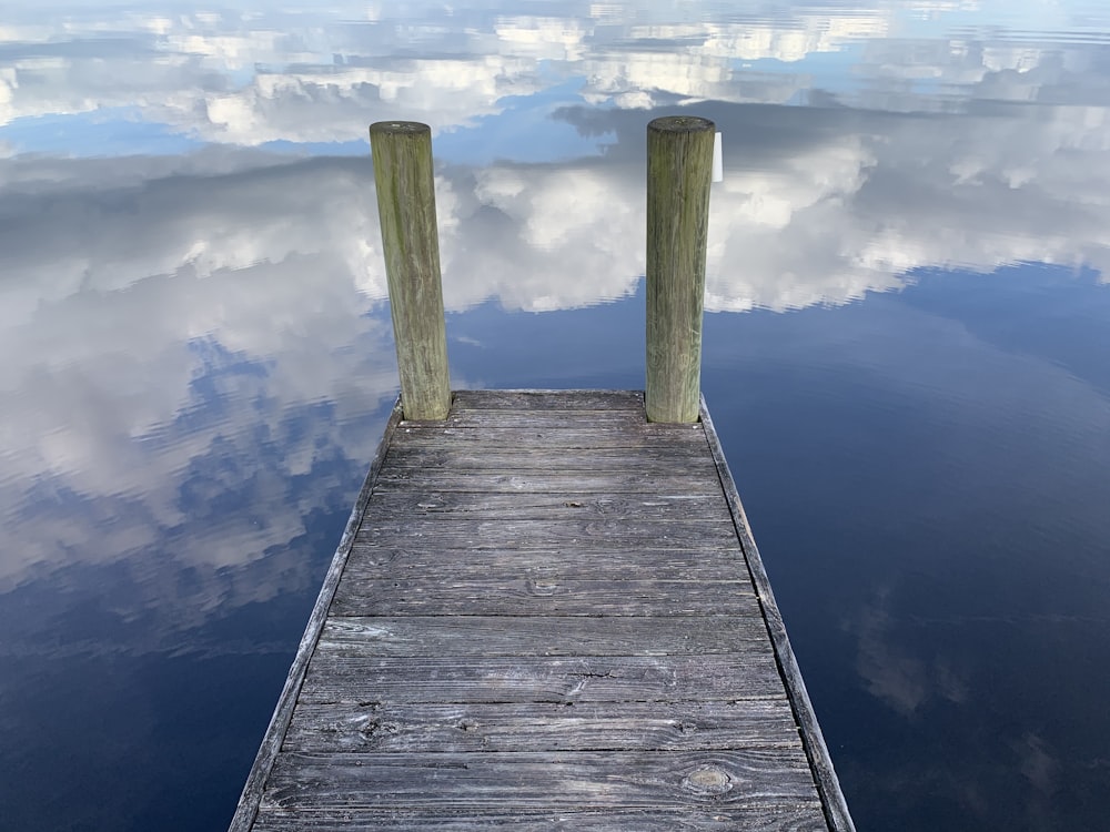 dock and calm body of water