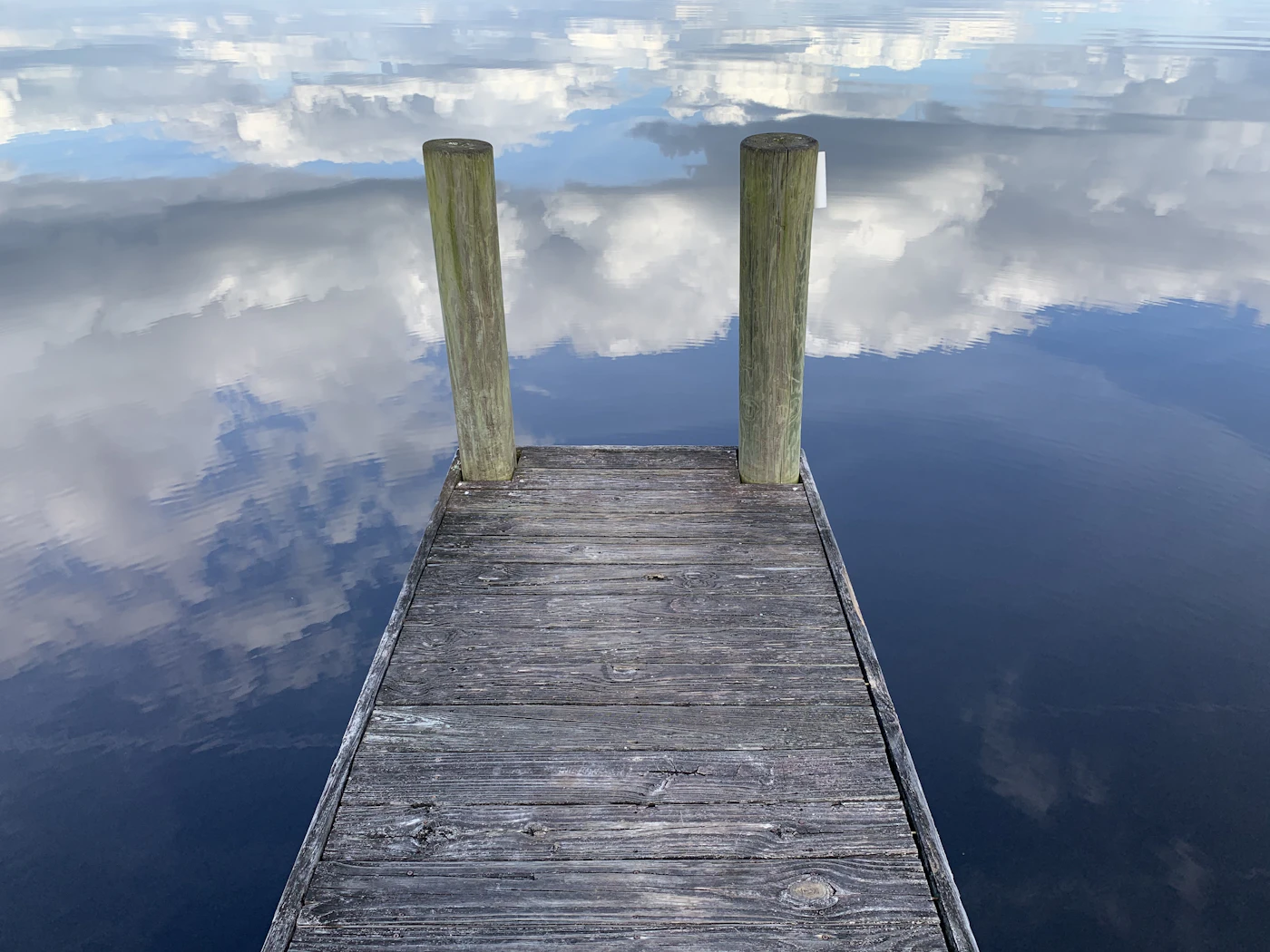 A dock on calm water. Lakes and greenways shape much of the Miami Lakes landscape.