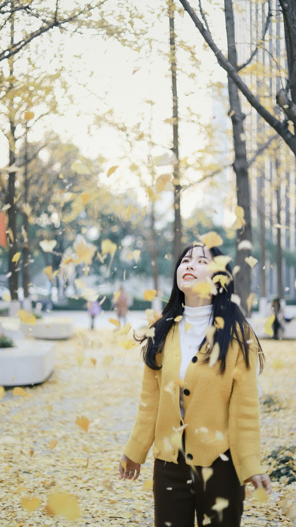 woman standing near trees