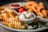 A plate featuring crinkle-cut fries, breaded and fried chicken strips, a small bowl of creamy sauce, and fresh cherry tomatoes. Garnishes include greens such as arugula, adding a touch of color and freshness.