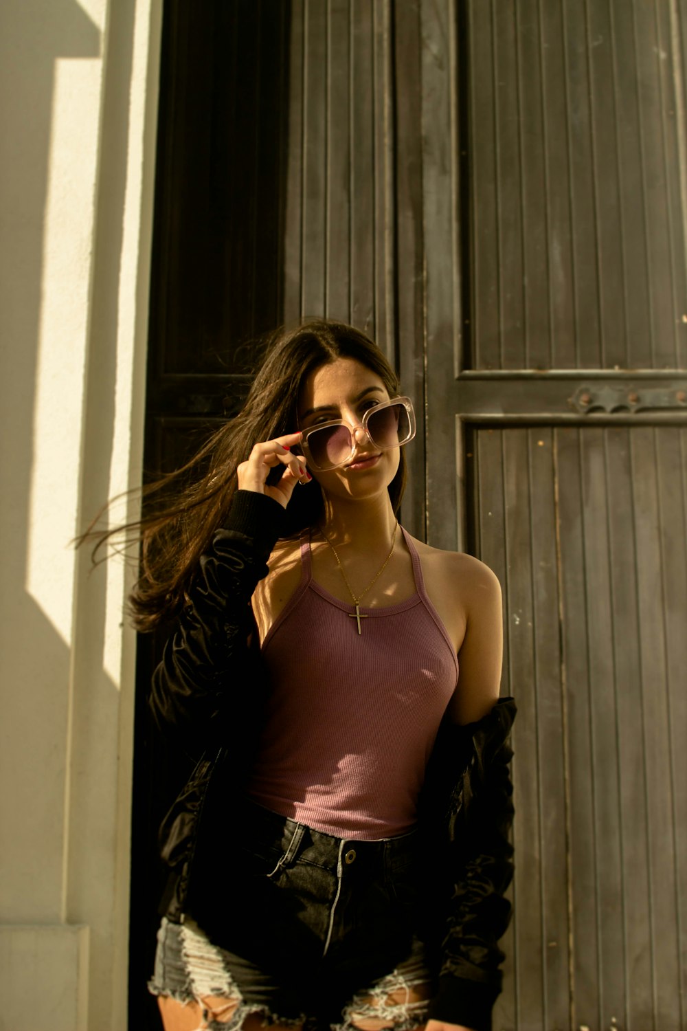 woman standing beside wall