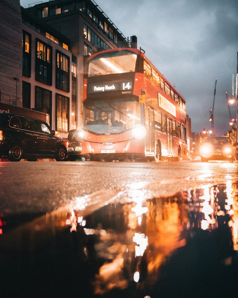 red bus on road