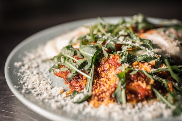 Close-up photo of a beautifully styled dish with vibrant colors and natural light highlighting textures.