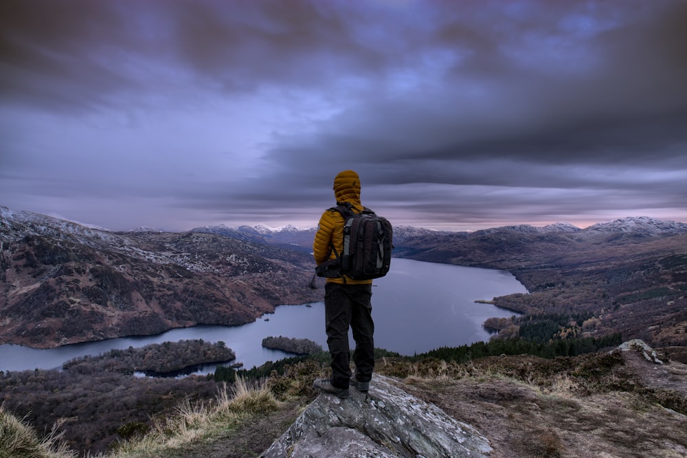 man standing on hill