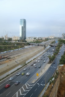 Aerial view of a busy highway with trucks transporting goods.