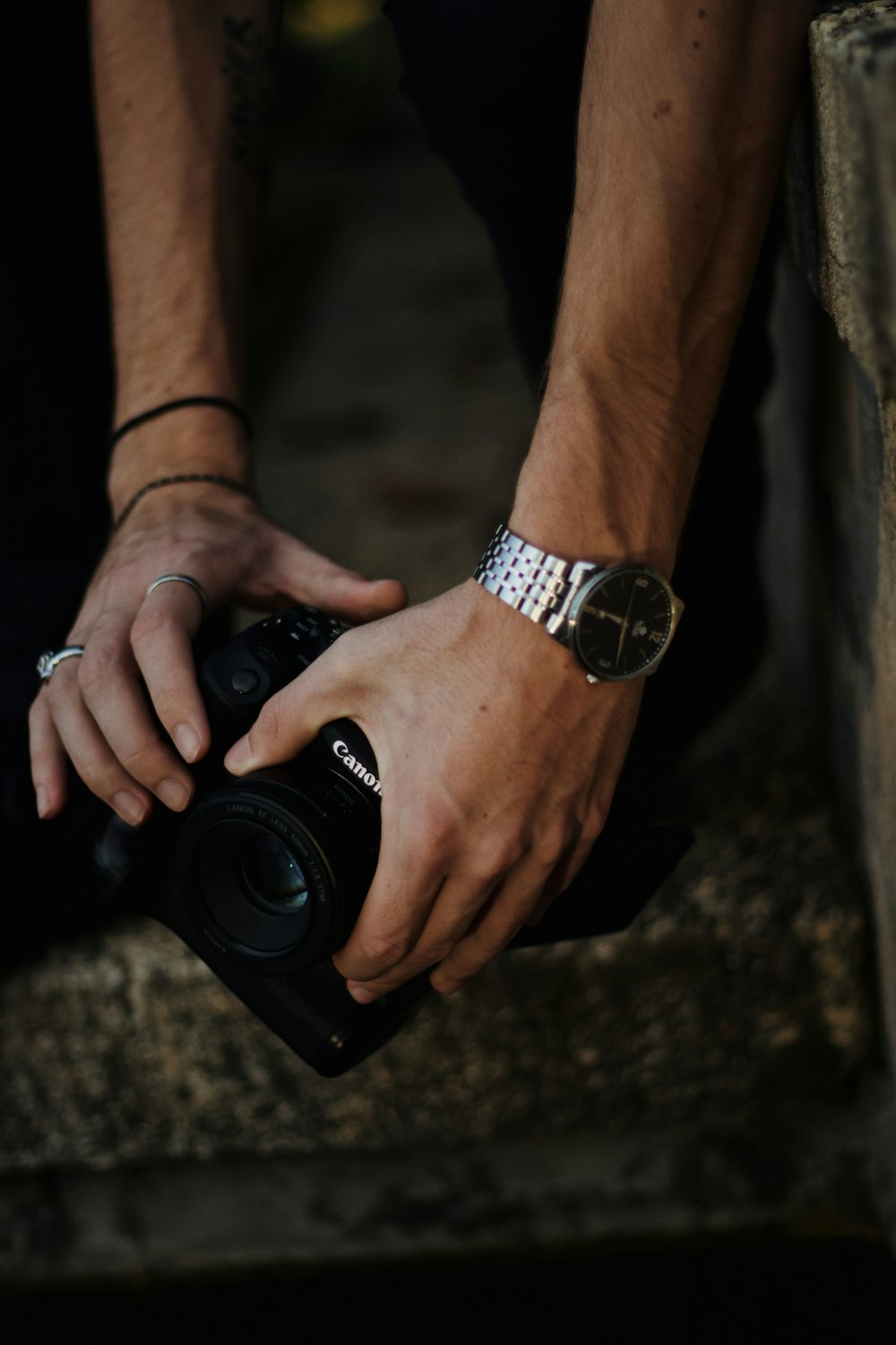 person holding Canon camera