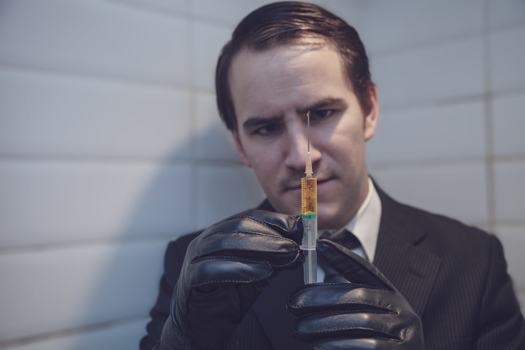 man holding syringe