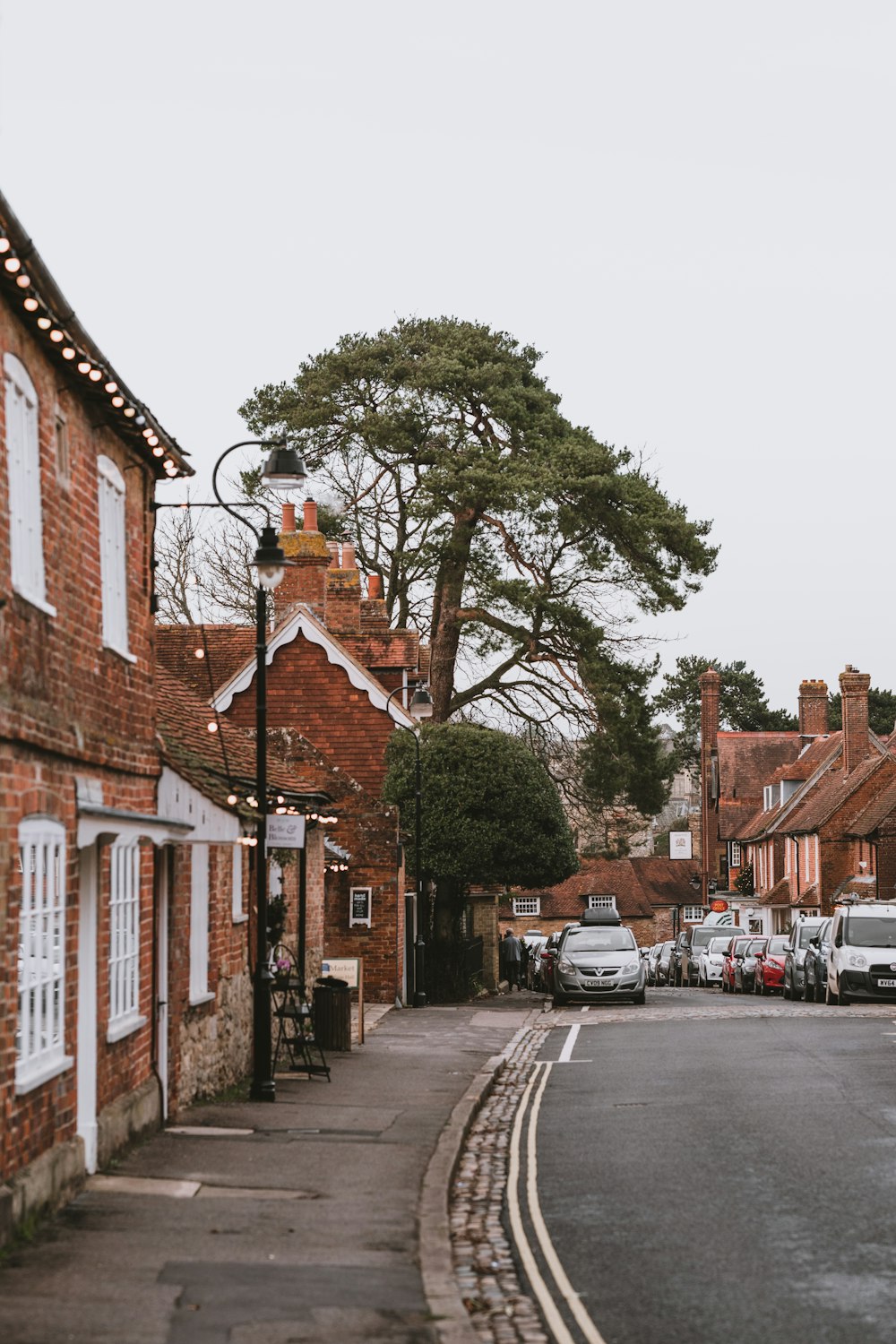 buildings, road, and cars during day