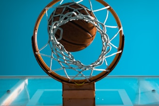 brown basketball near basketball ring