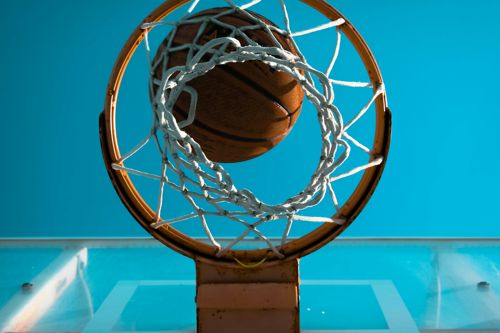brown basketball near basketball ring