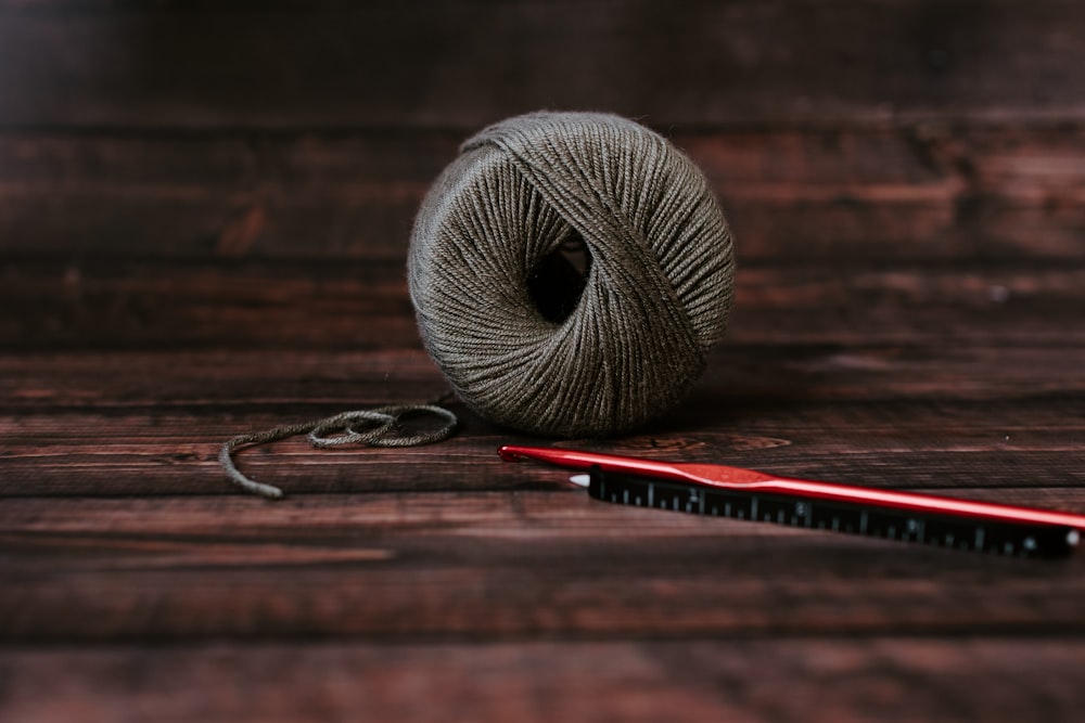 gray yarn ball on table