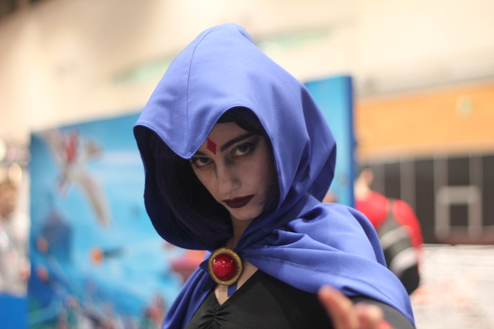 woman wearing DC Raven costume indoors