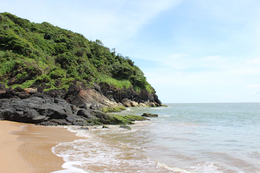 grass covered mountain island during day