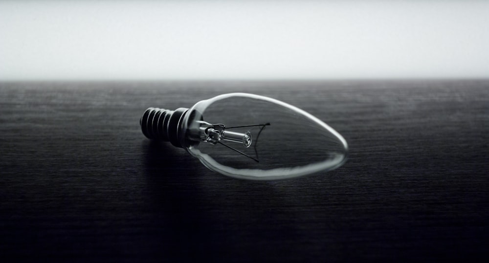 grayscale photography of light bulb