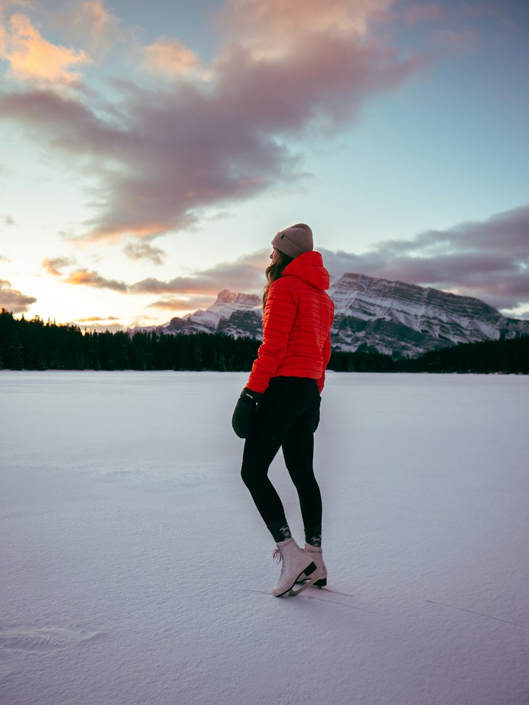 woman standing on frozen lake