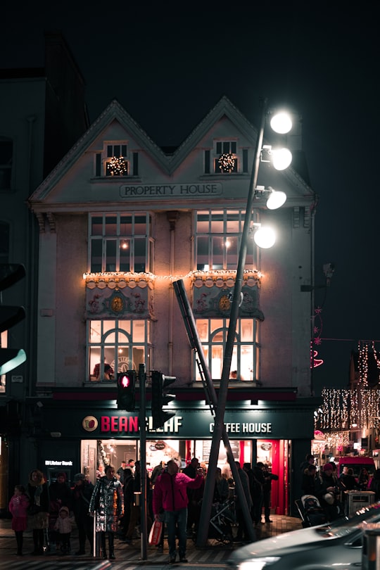 people standing beside building in Cork Ireland