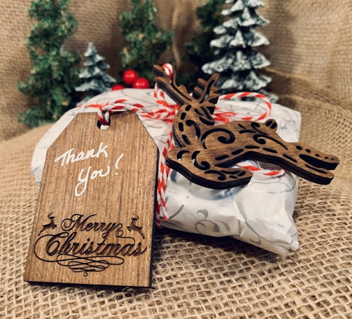 A beautifully wrapped gift with a tag that says 'Thank You, Neighbor'.