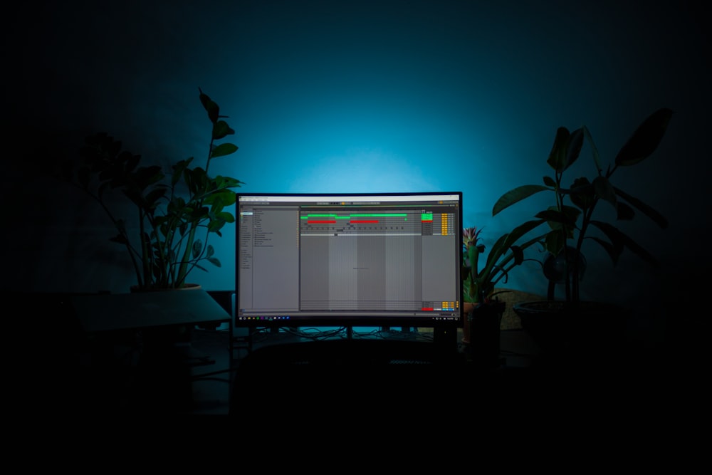 a computer monitor sitting on top of a desk