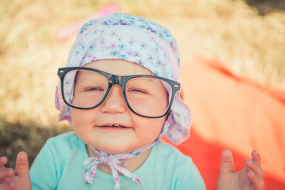 toddler wearing black framed eyeglasses