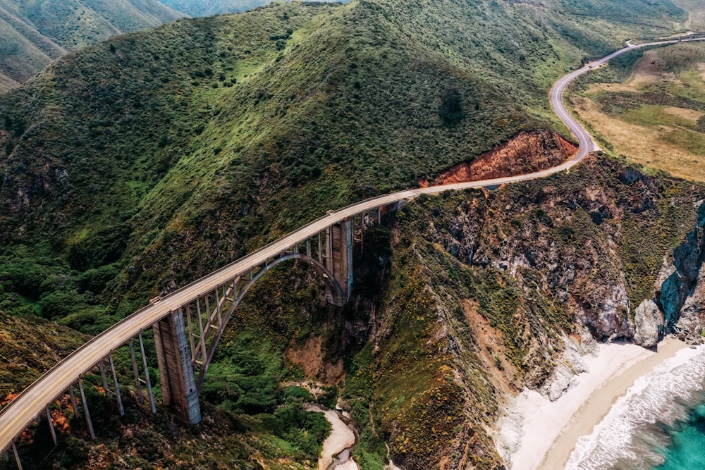 aerial photo of road beside mountain