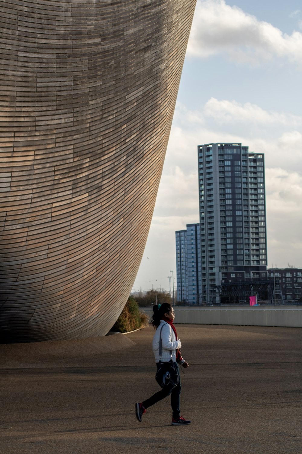 woman walking near building