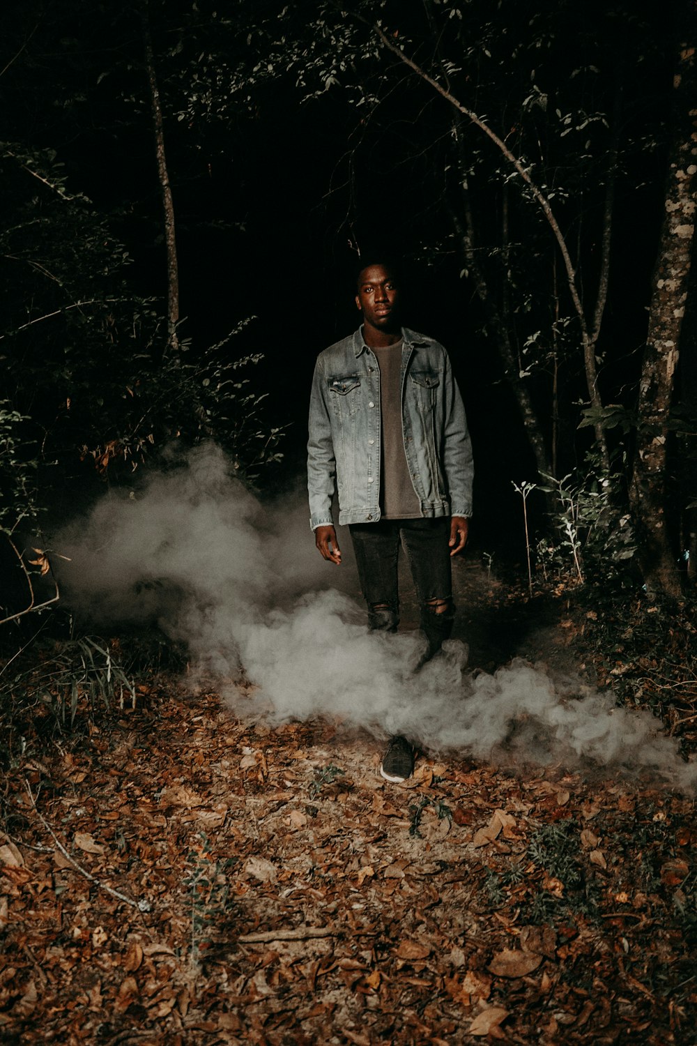 man standing near trees