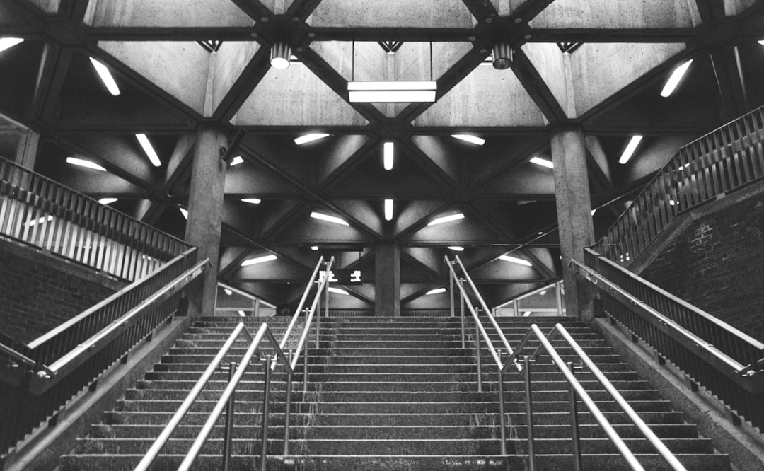 grayscale photo of stairway inside building