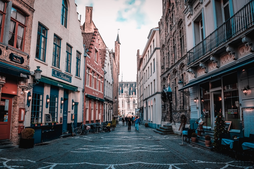 people walk between alleys