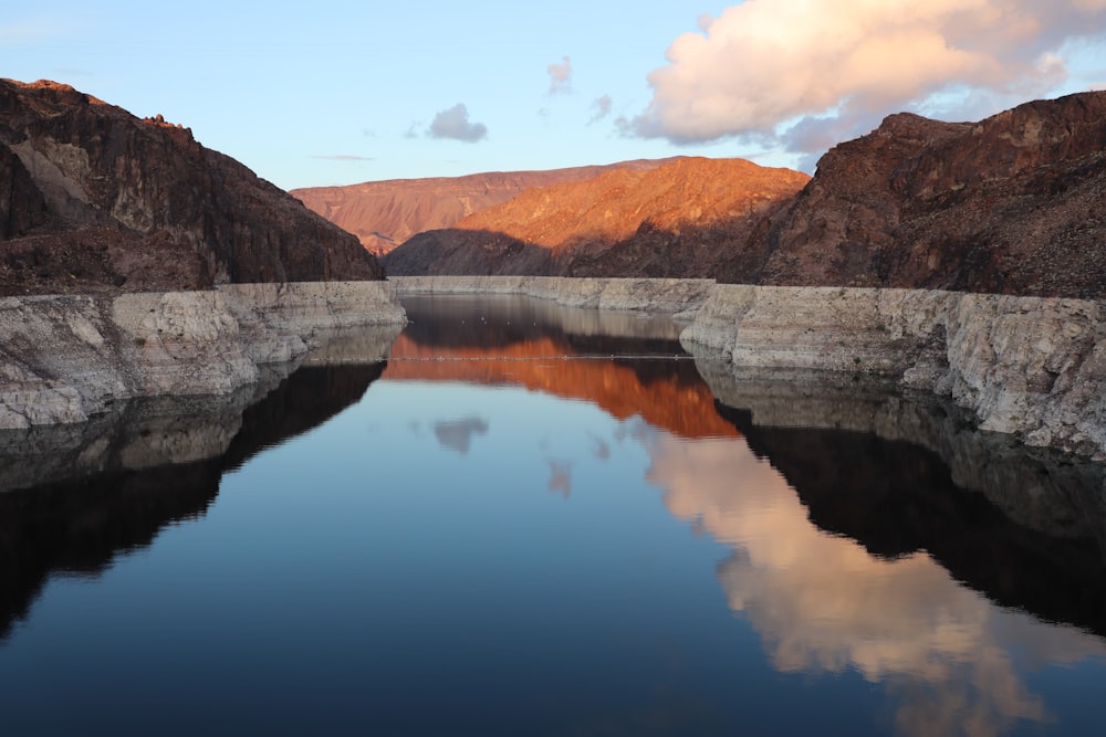 rock formations surrounding body of water