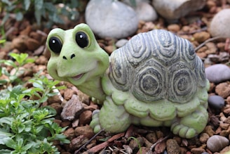 A cozy turtle habitat with lush greenery and a small Ferrari F1 car model nearby