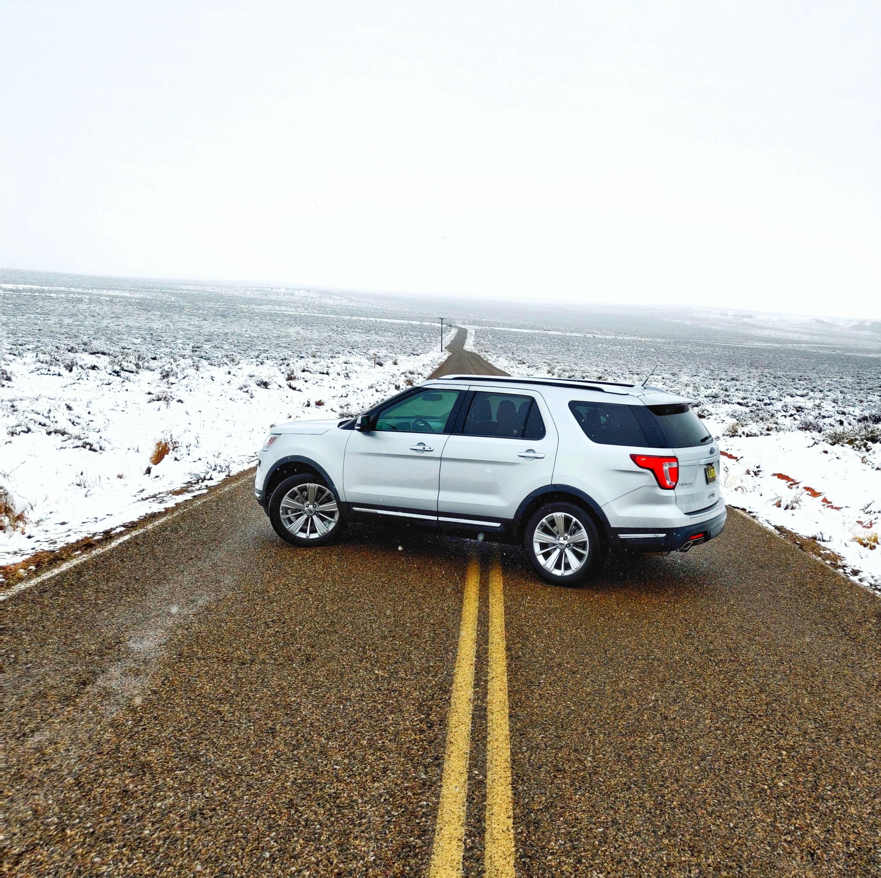 silver SUV parked on road