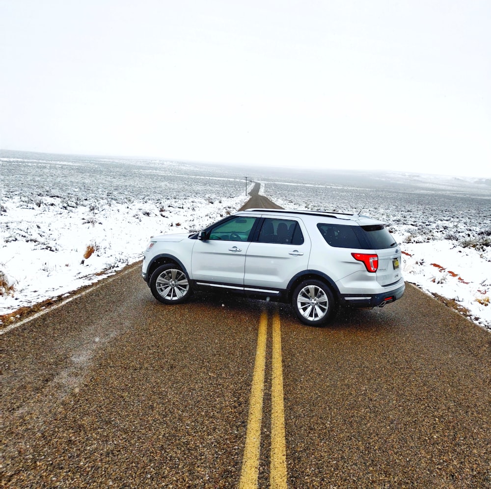 silver SUV parked on road