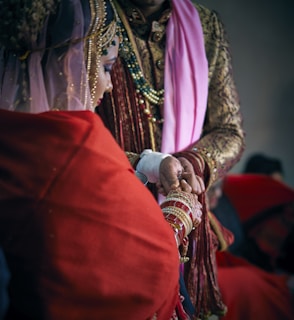 selective focus photography of man holding hand of woman