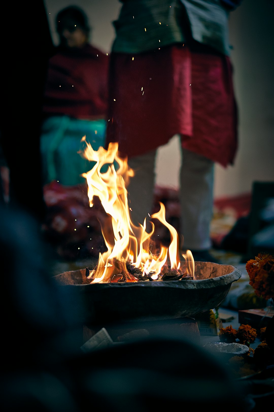 selective focus photography of person standing beside fire