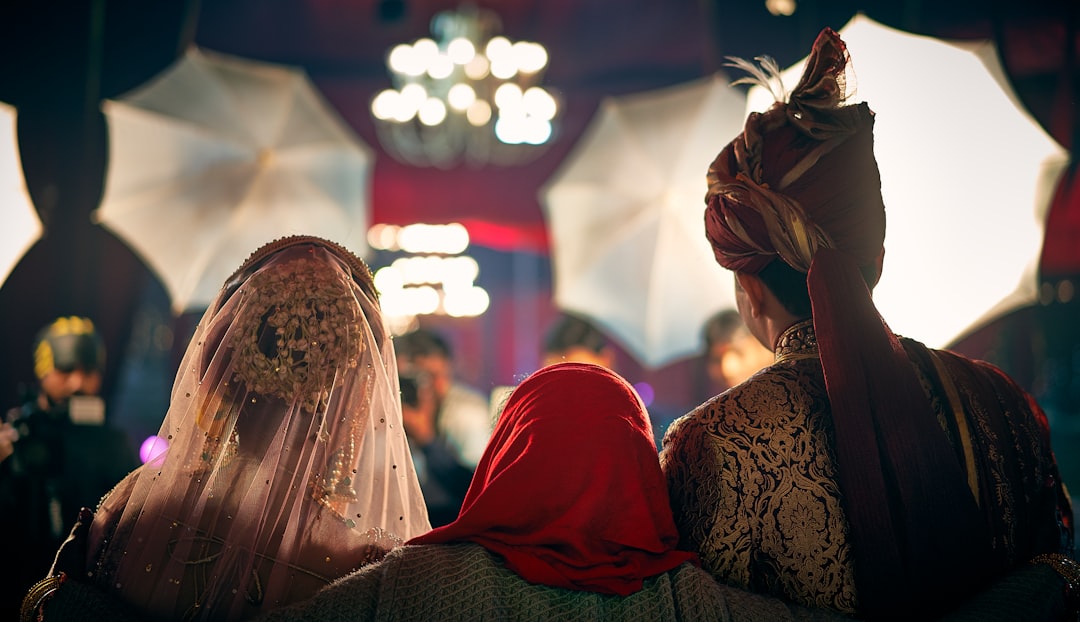 selective focus photography of woman standing between man and woman